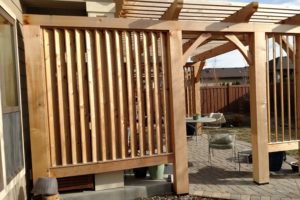 A pergola with wood panel screening at a Boise home.