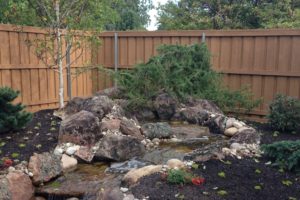 A custom built backyard waterfall feature.