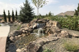 A custom built home garden waterfall feature.